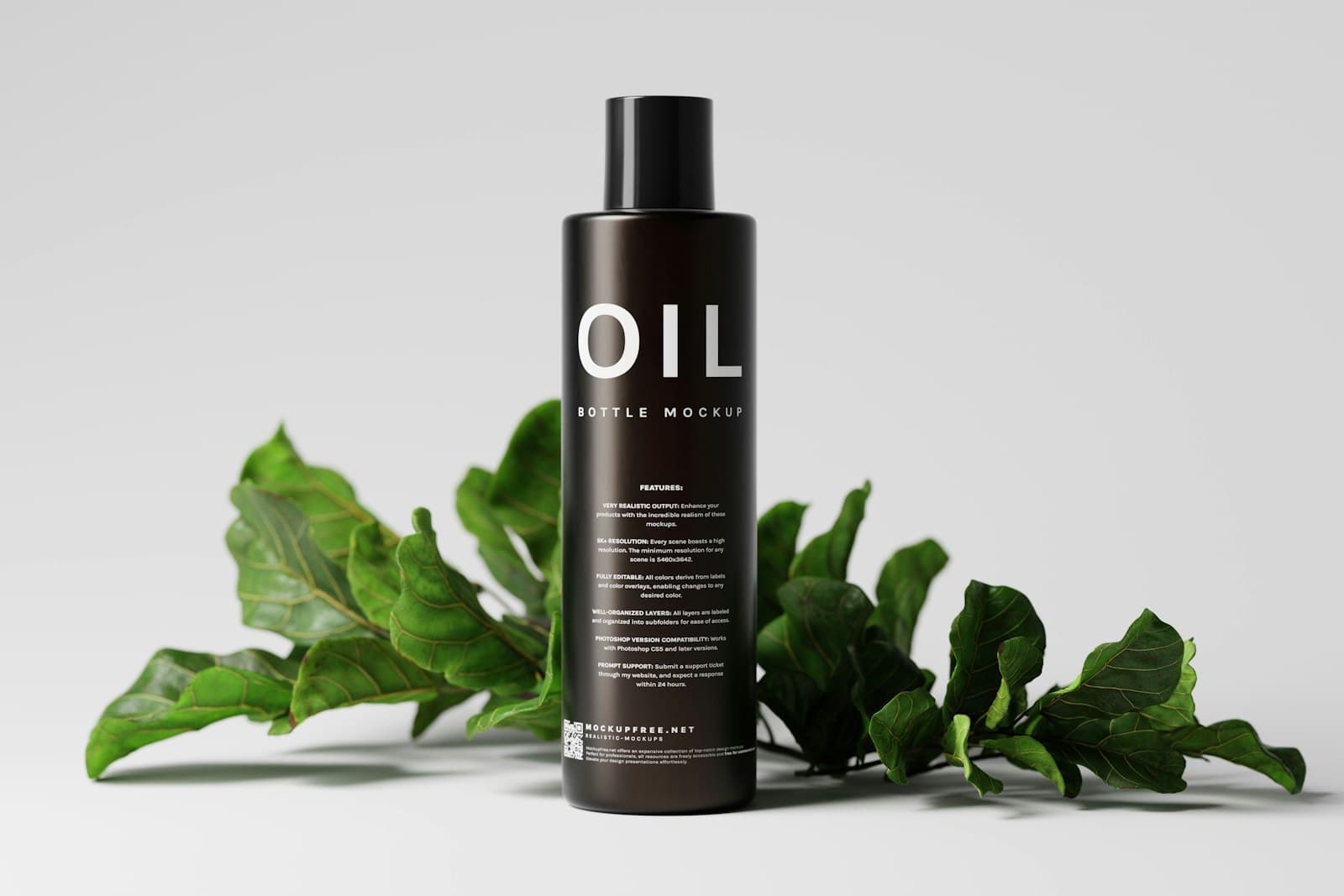 A bottle of hair oil beside a green plant