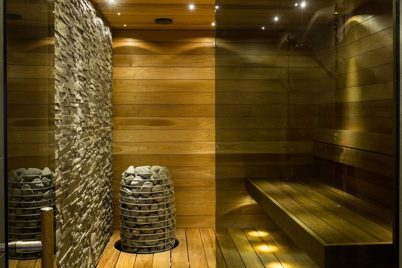 A warmly lit wooden sauna and spa interior